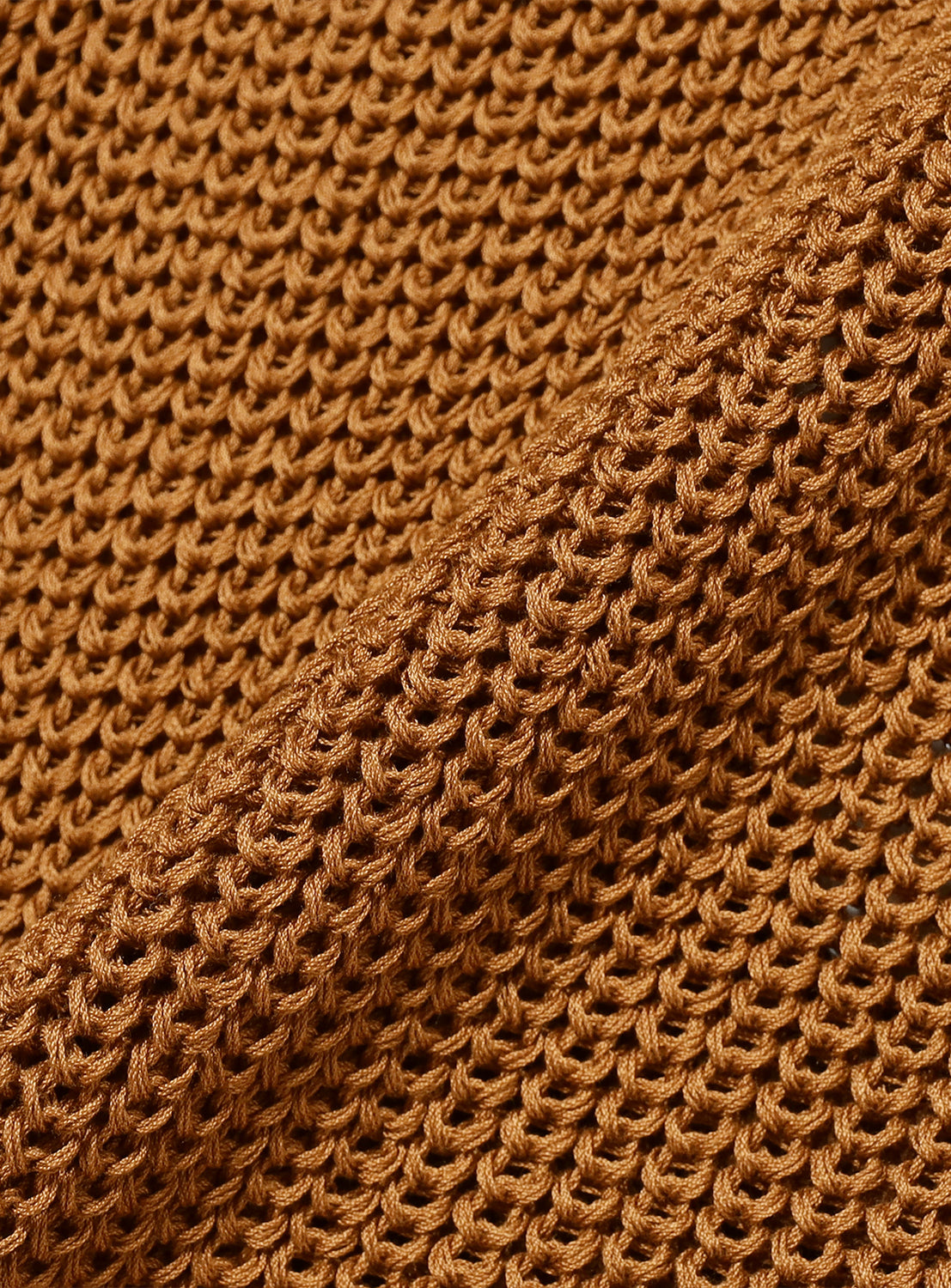Close-up of the tan material, highlighting the knit pattern.