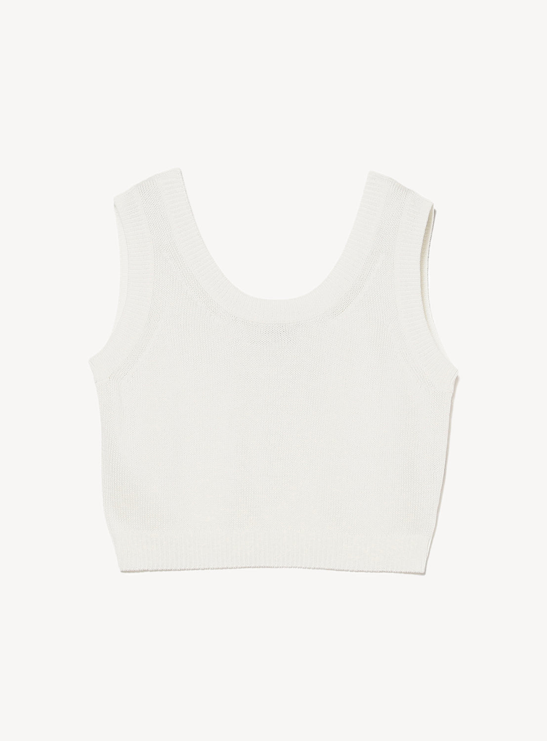 White sleeveless cropped knit top with a wide scoop neckline and a ribbed hem.