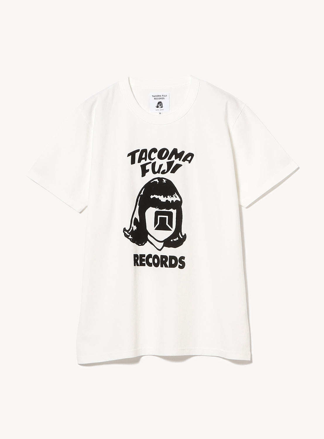 White t-shirt flat lay, featuring a black stylized head graphic with "Tacoma Fuji Records" text.