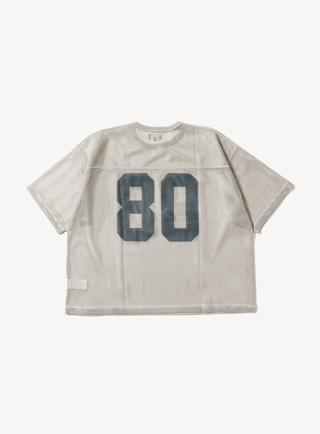 Full flat lay of a beige mesh football jersey, showcasing the classic "80" graphic and oversized fit.