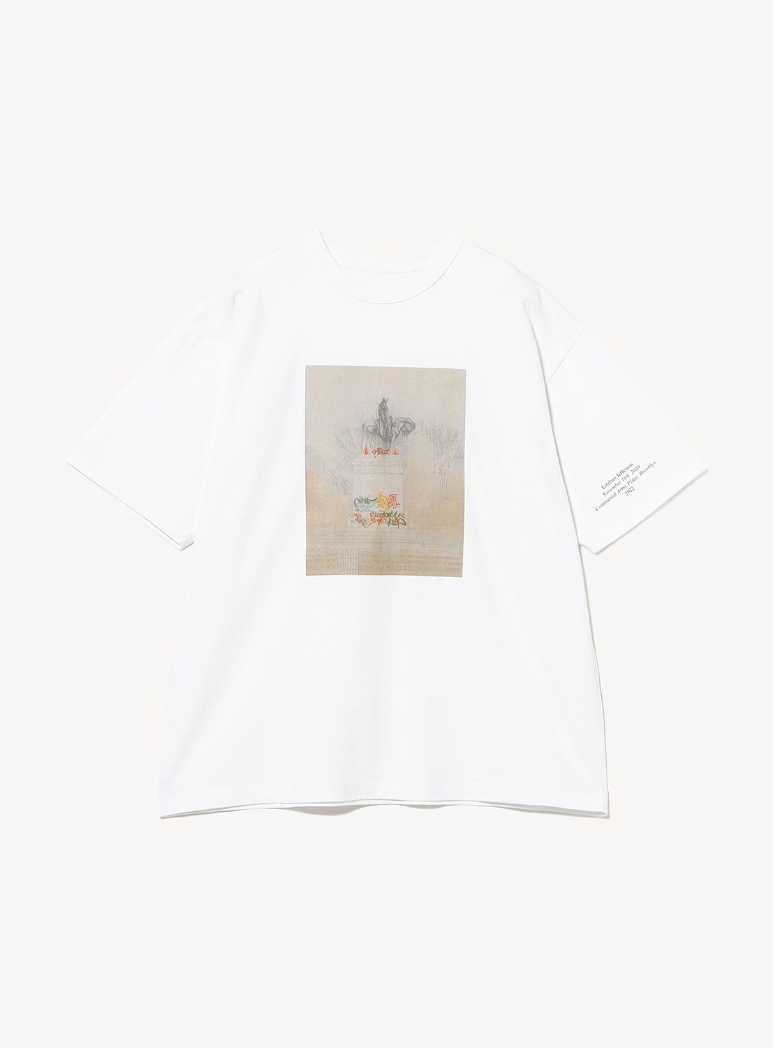 The BEAMS T Esteban Jefferson ‘Robert E. Lee’ Graphic T-Shirt is an oversized white tee made from heavyweight US-grown cotton, showcasing a muted, vintage-style illustration of a layered cake and candles on the chest, with small text printed on the left sleeve. The background is plain white.