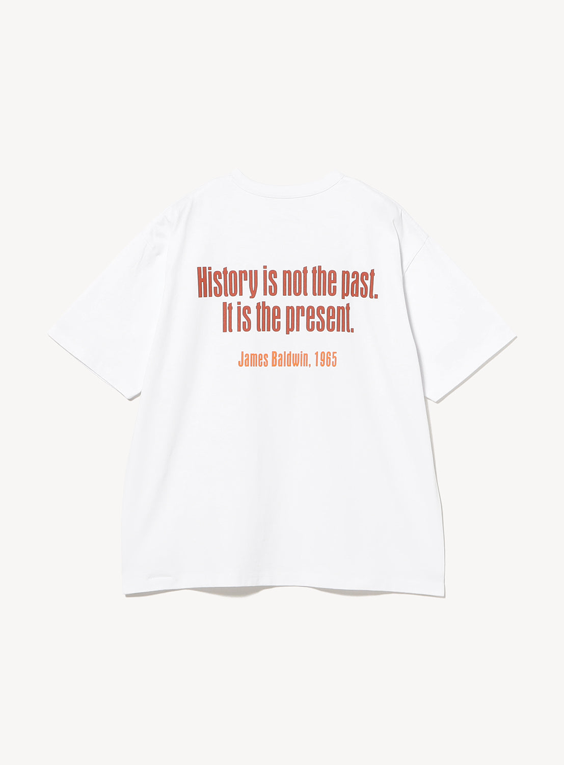 The BEAMS T Esteban Jefferson ‘Robert E. Lee’ Graphic T-Shirt is crafted from heavyweight US-grown cotton and features red text on the back reading, “History is not the past. It is the present. James Baldwin, 1965.” The shirt is displayed laid flat against a plain white background.
