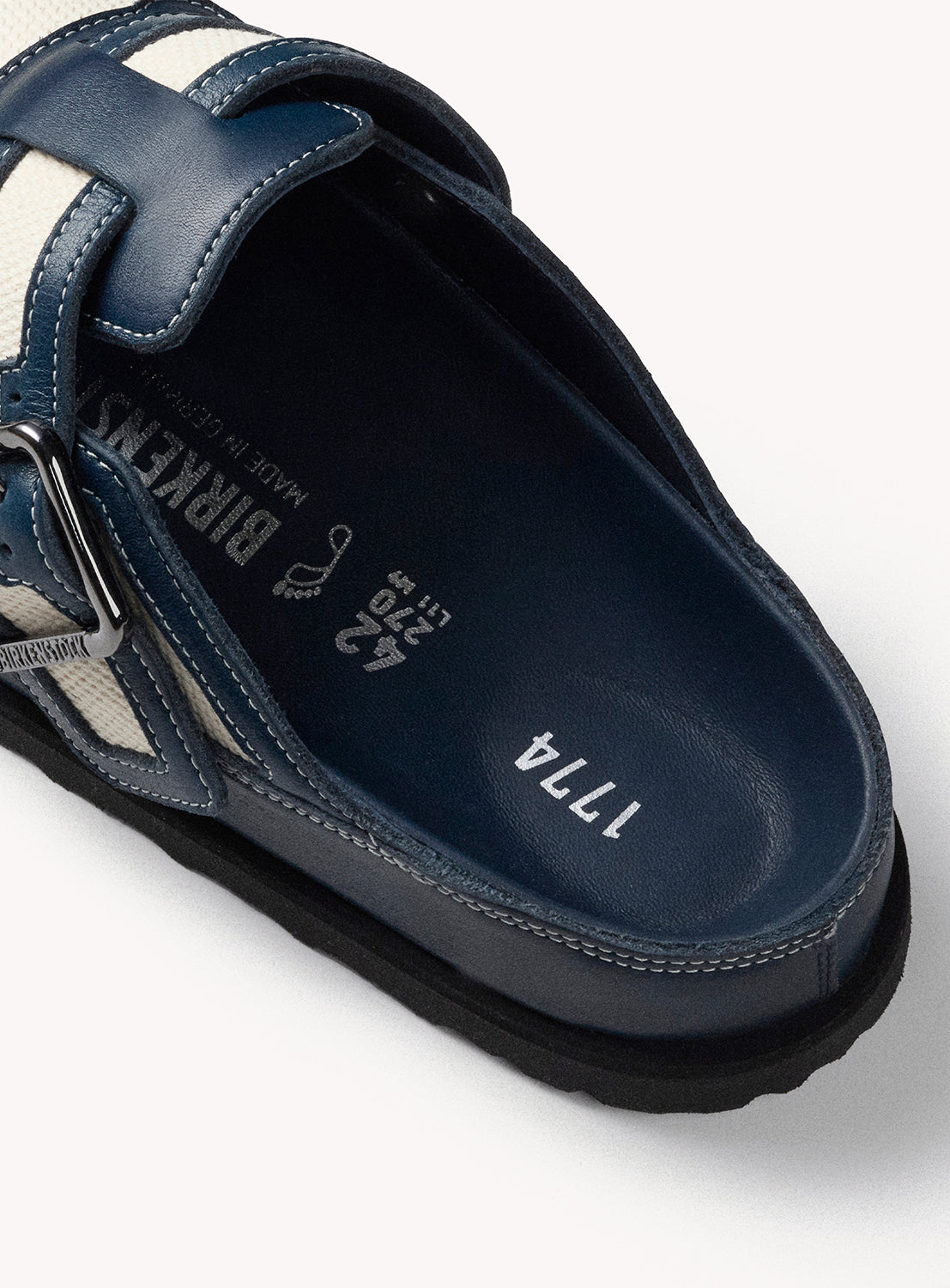 Navy blue sandal with brand logo on a white background