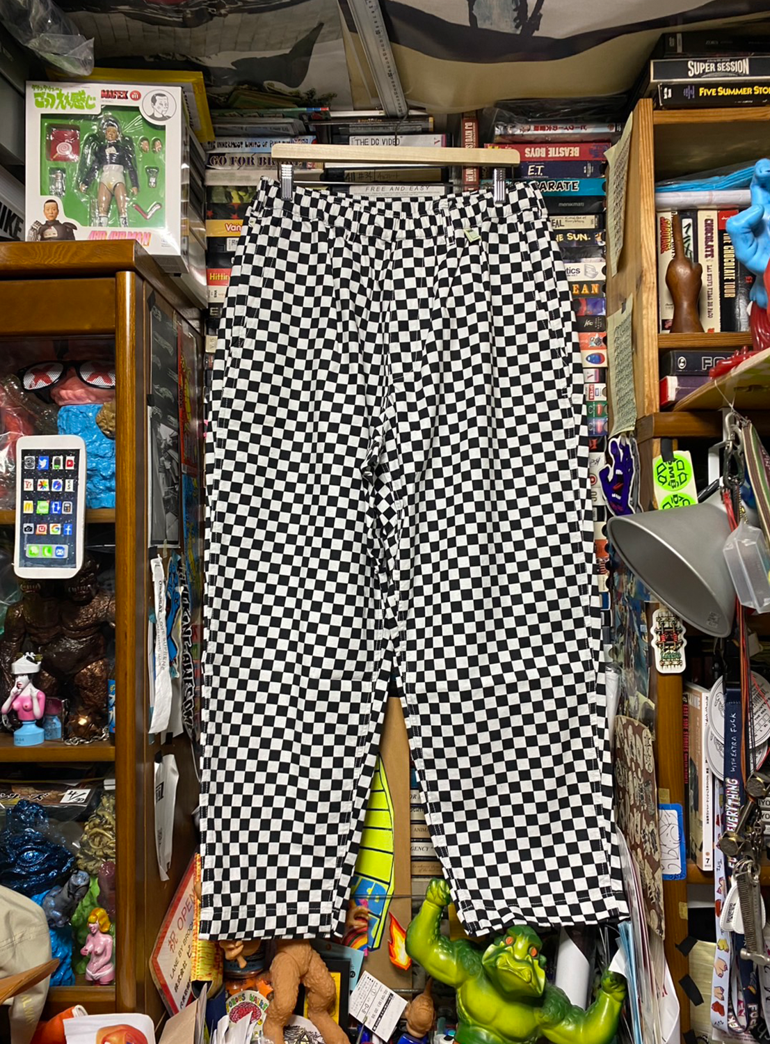 Black and white checkered pants, a tribute to West Coast attitude and laid-back skate and surf culture.