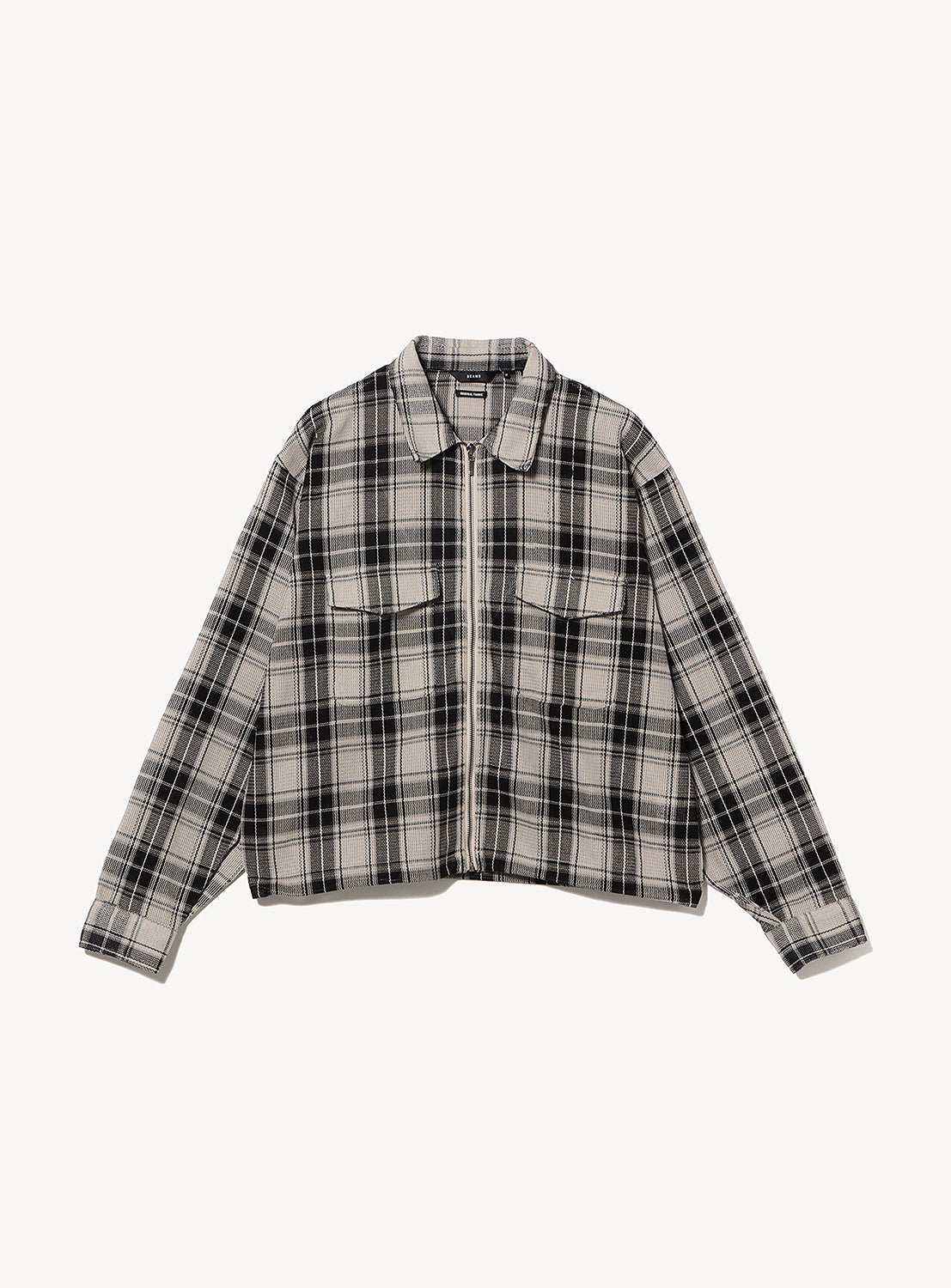 BEAMS Classic Check Mesh Zip-Up Shirt in a grey and black plaid mesh fabric with a relaxed silhouette and two chest pockets.