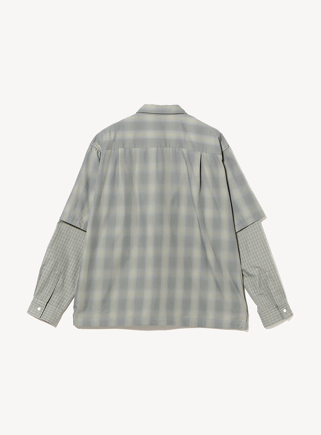 Back view of a gray, wide-fit BEAMS Layered Check Shirt featuring short sleeves over long, darker-checked sleeves.