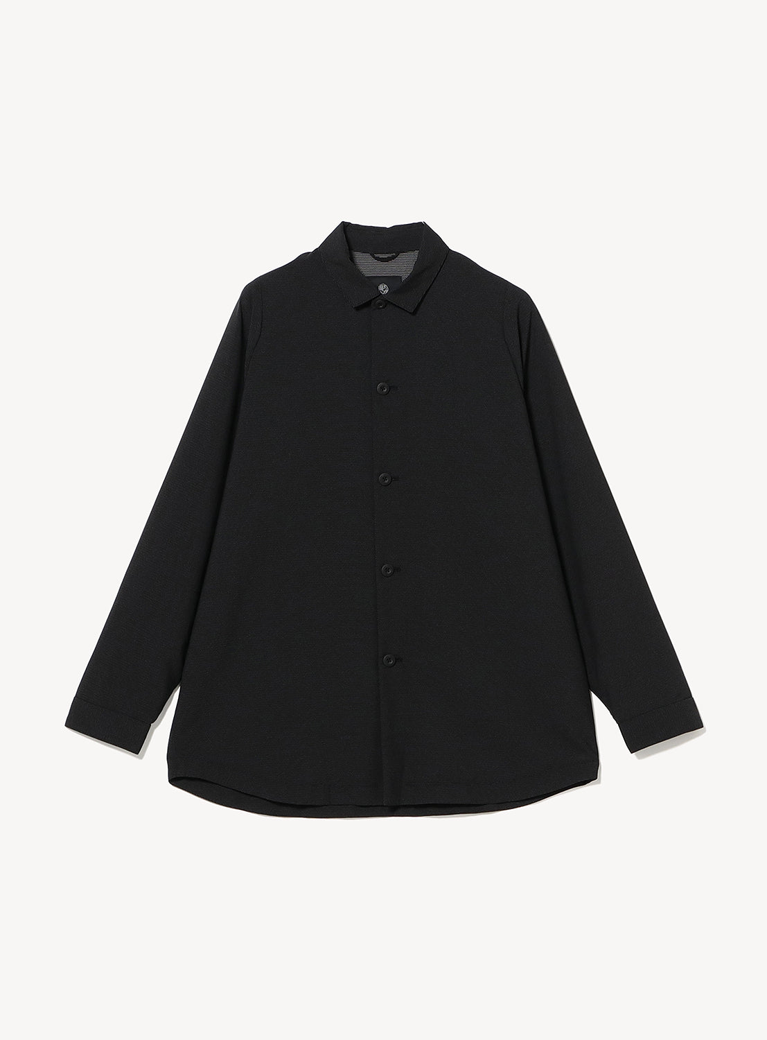 The TEATORA Long Sleeve Cartridge Shirt, a black, collared button-up, is shown laid flat on a white background. Made from wrinkle-resistant fabric, this travel shirt is perfect for maintaining a polished look wherever you go.