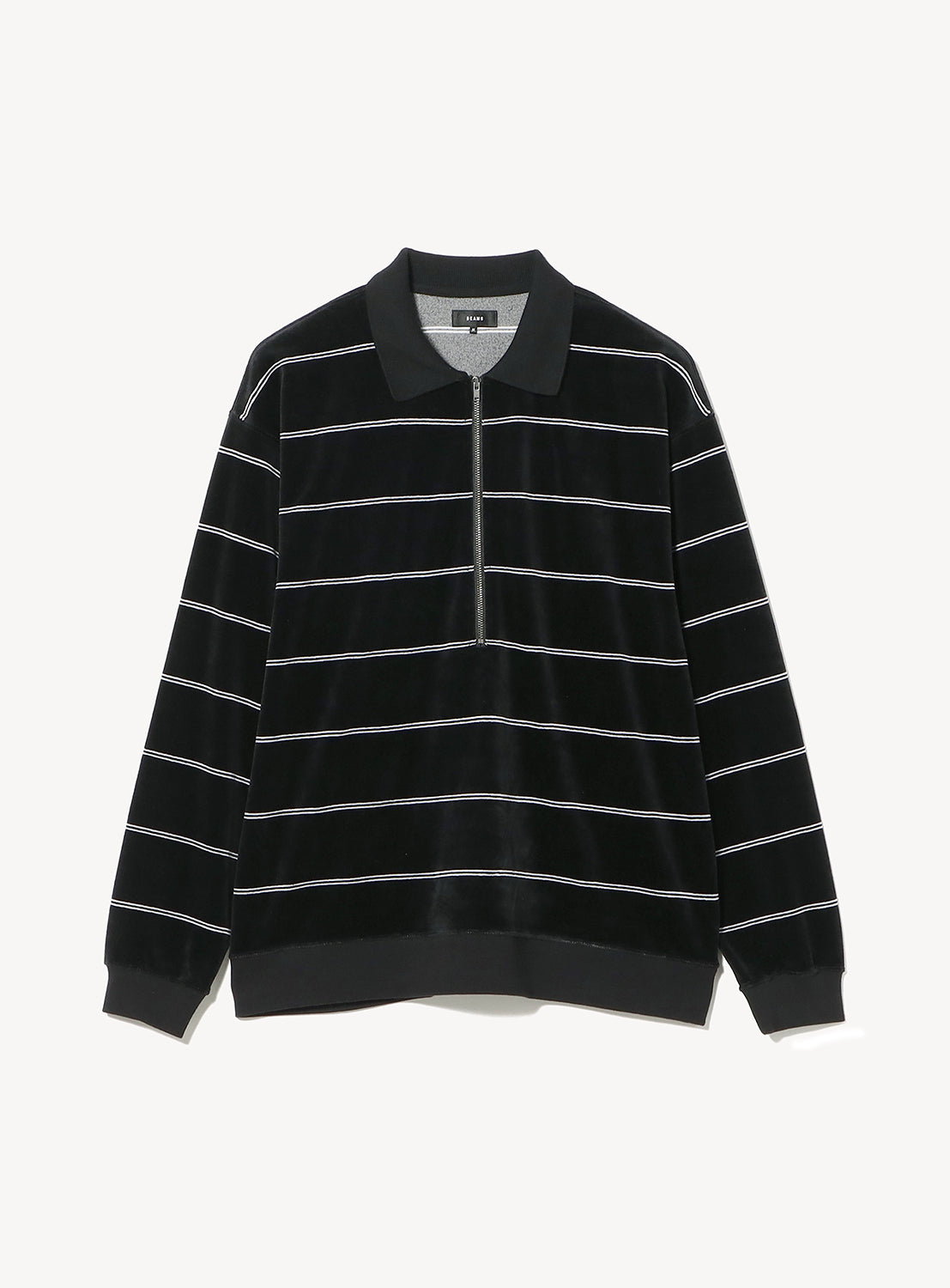 BEAMS Striped Velvet Polo Shirt in black with a half-zip neckline, horizontal white stripes, and relaxed proportions.