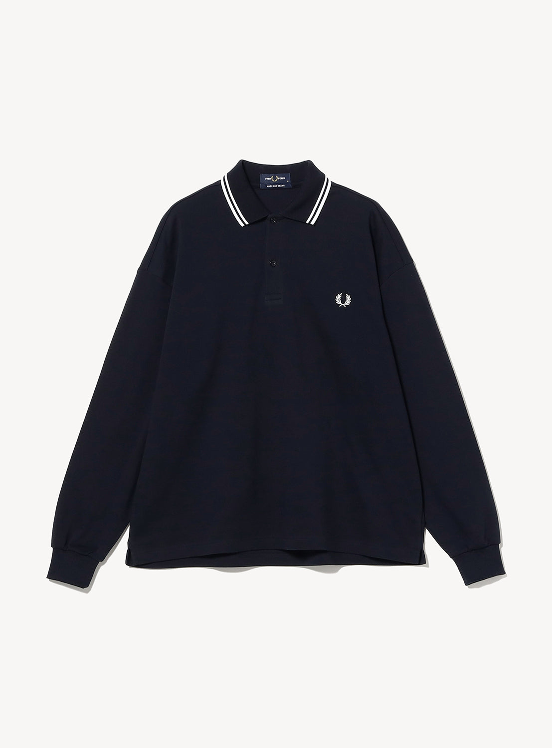 [Exclusive] BEAMS x Fred Perry Pique Long Sleeve Polo Shirt in dark navy, featuring a boxy silhouette, white-striped twin-tip collar, and an embroidered chest logo.