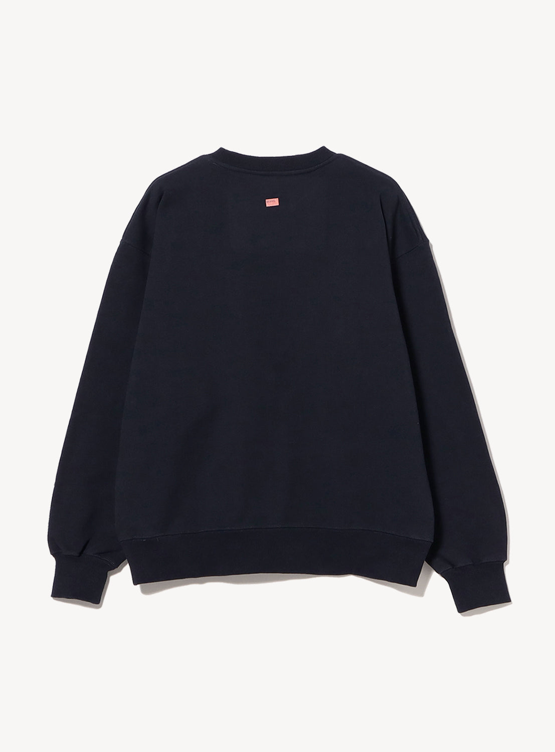 Back view of navy BEAMS T Emilio Chavez crewneck sweatshirt with logo patch.