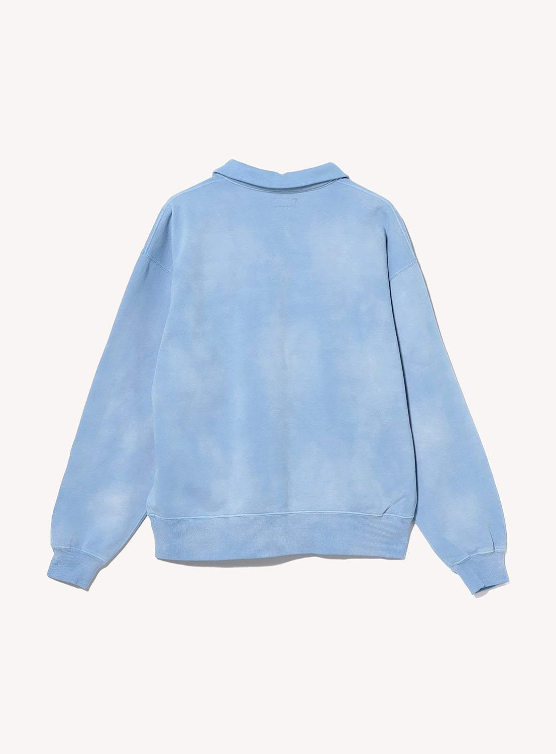 Back view of a light blue BEAMS Faded Souvenir Half Zip Pullover, featuring a cropped silhouette, a collar, and a zippered neckline.