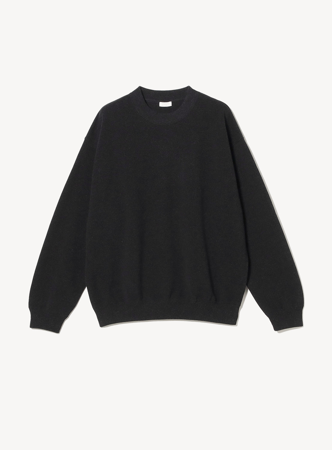 Black crew neck sweater on a white background. 
