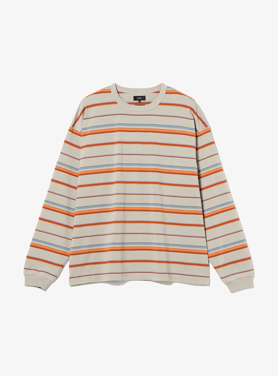 BEAMS Loose Fit Border Long Sleeve T-Shirt in a wide-fit crewneck style with a horizontal striped pattern in orange, blue, and brown on a beige base.