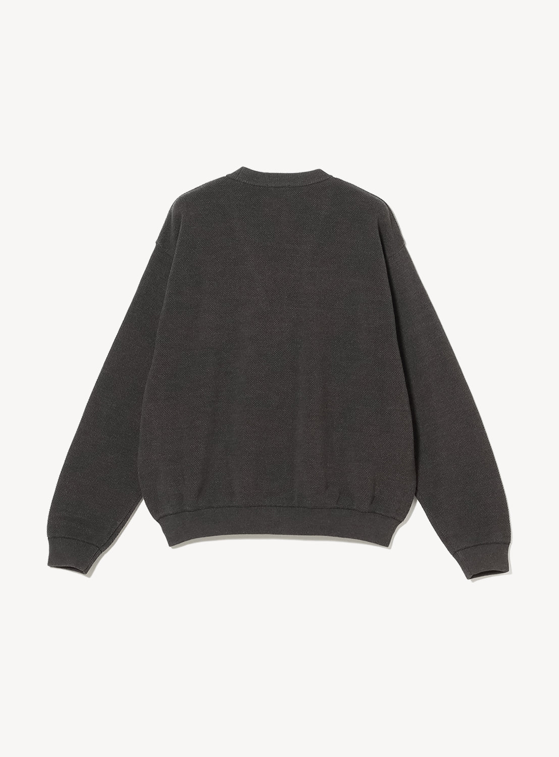 Back of a charcoal gray button down cardigan with pockets on a white background.