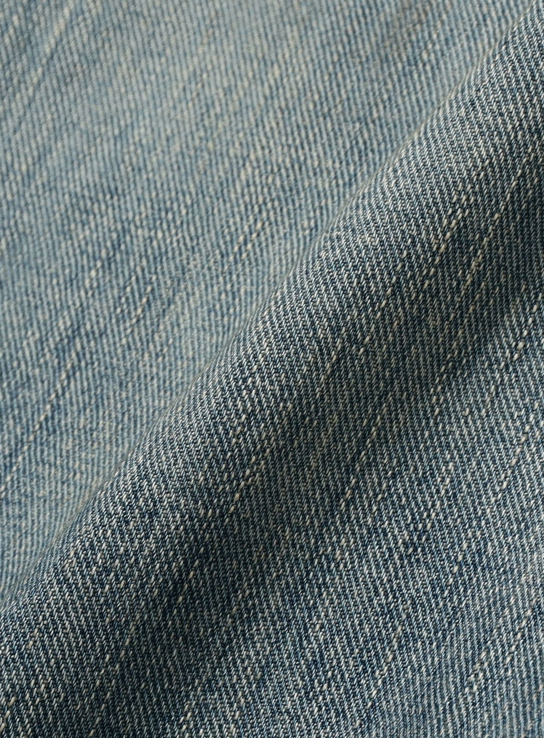 Close-up of blue denim fabric with visible texture