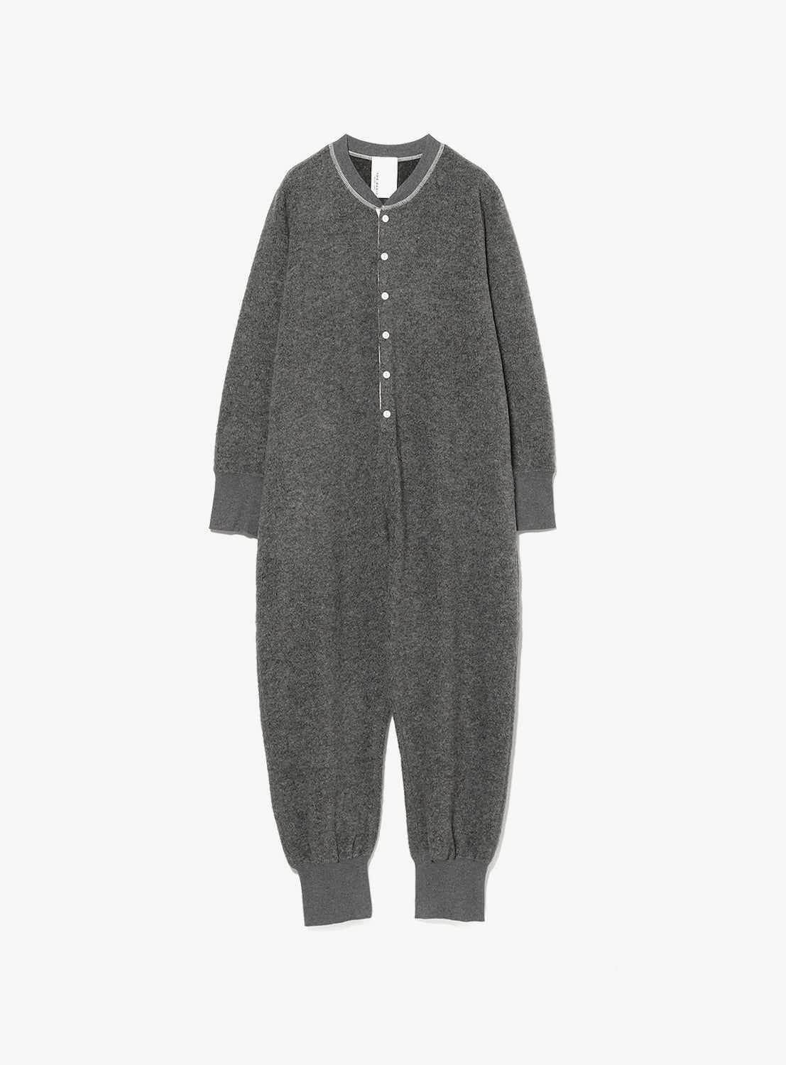 A versatile wardrobe staple, the THE BASIC Knit Jumpsuit is a gray, long-sleeve, full-length baby or toddler onesie featuring snap buttons down the front and ribbed cuffs at the wrists, ankles, and neck—shown here on a plain white background.