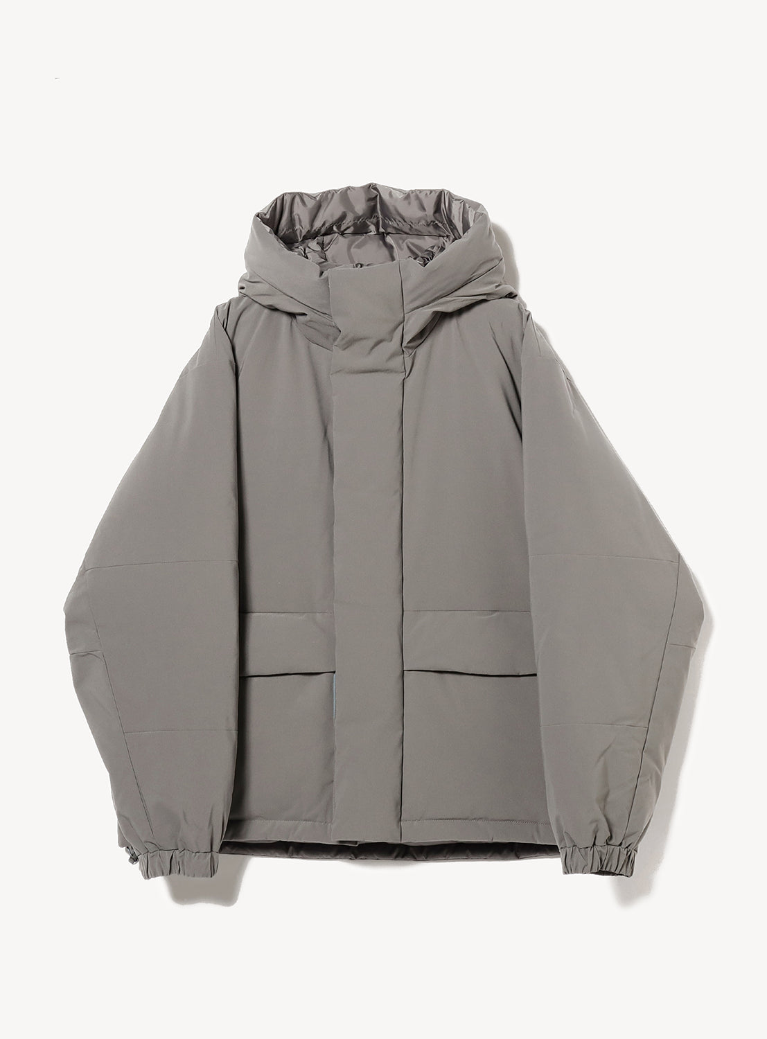Gray hooded reversible jacket with a hidden zipper and two front pockets. 