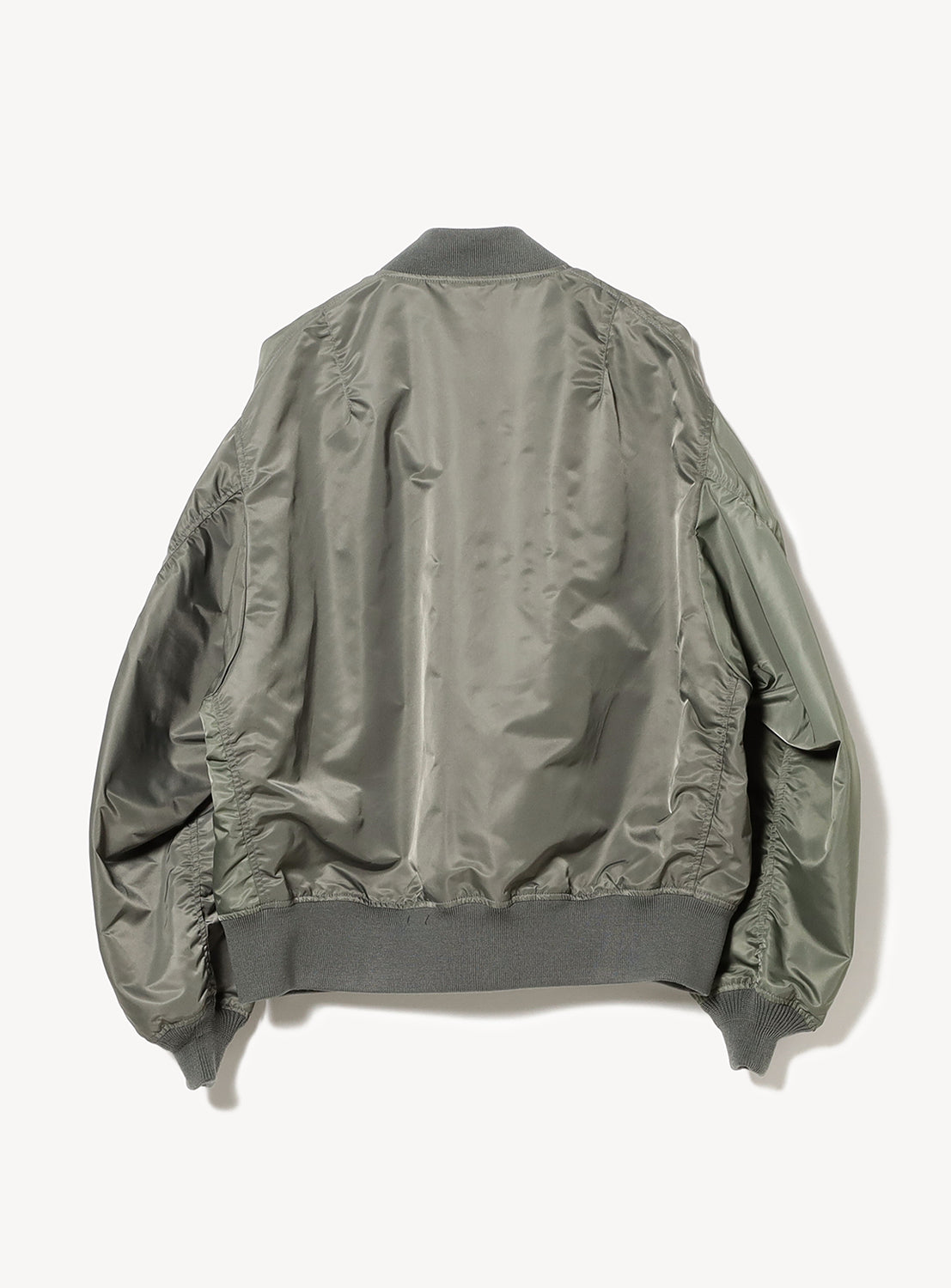 Top-down view of an olive green Water-Repellent Wide-Fit Crazy MA-1 Bomber Jacket, showcasing ribbed cuffs and waist for contemporary shape.