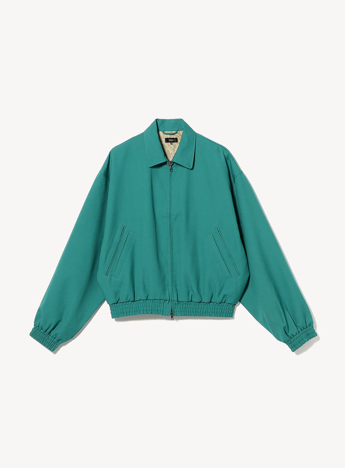 BEAMS Gabardine Zip Blouson in teal wool gabardine with a collar, elasticized cuffs and hem, side pockets, and a vintage-style paisley lining.