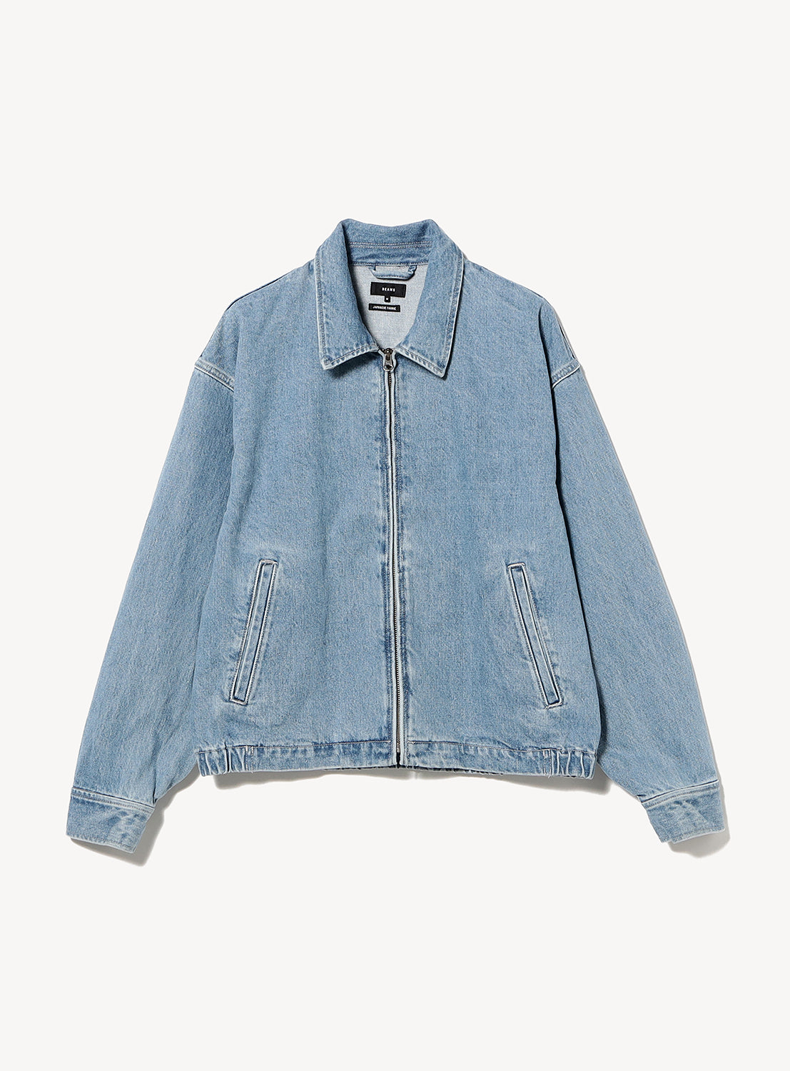 BEAMS Nep Denim Zip Jacket in vintage-inspired light blue, featuring a fold-down collar, silver front zipper, and two side pockets.