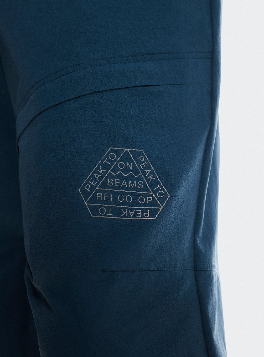 Close up of the BEAMS x REI CO-OP x ON Running logo. 
