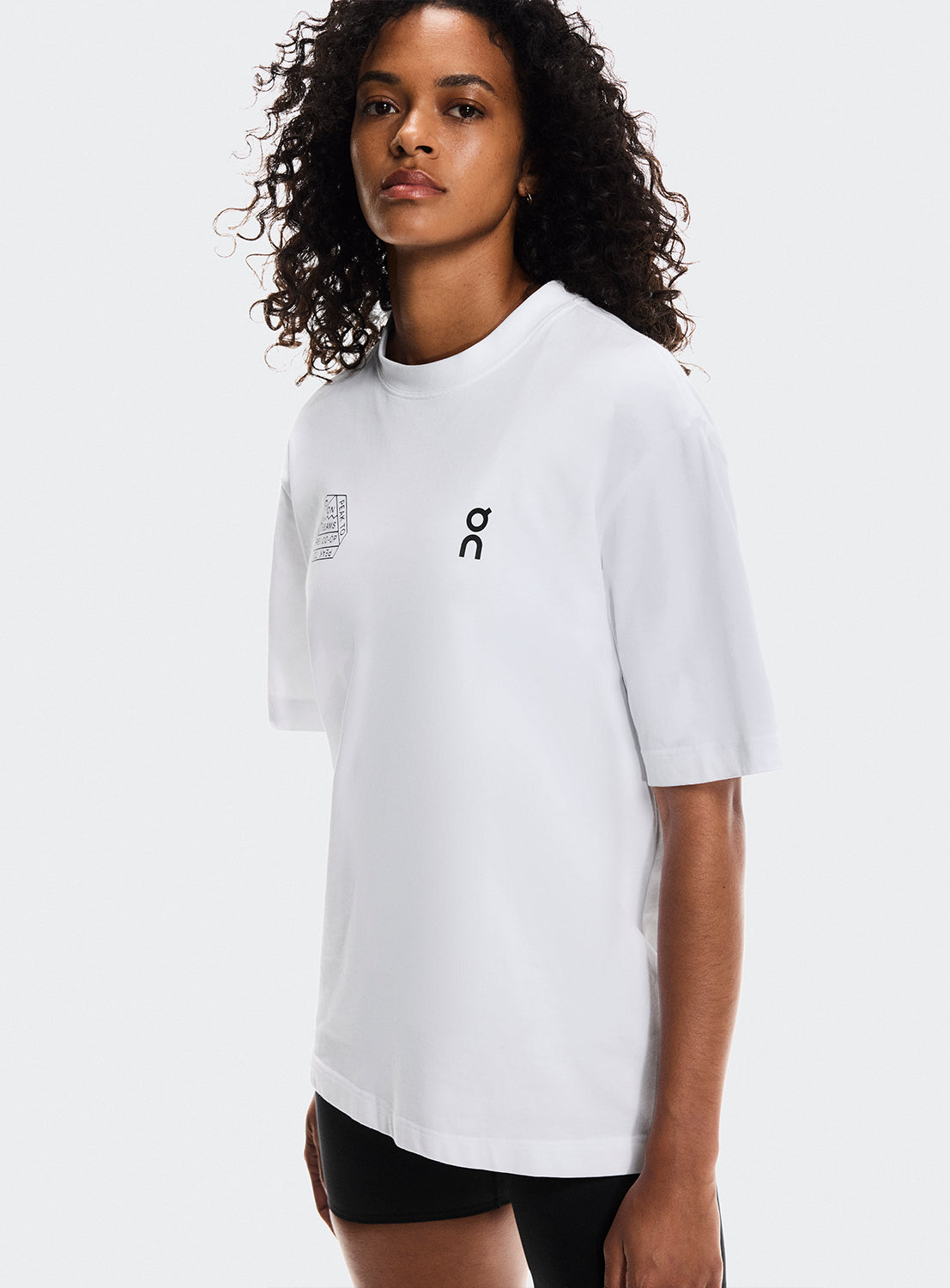 Models wearing a white t-shirt with ON Running, BEAMS, and REI CO-OP logos.