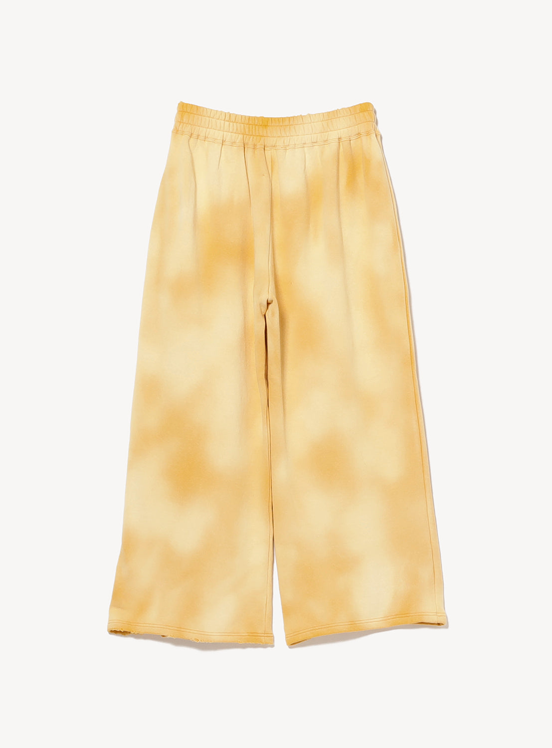 The INSCRIRE Yellow Faded Sweat Wide Pants are wide-leg, high-waisted sweatpants with an elastic waistband, crafted from soft loopback cotton and featuring a yellow and light orange tie-dye effect, shown laid flat on a white background for a vintage-inspired look.