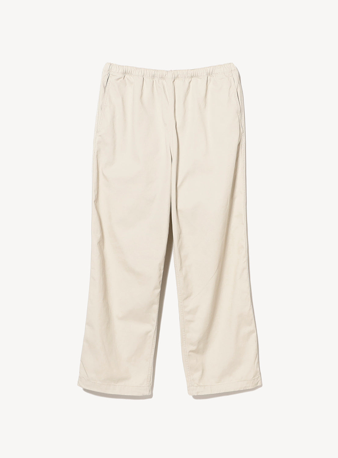 The BEAMS Basic Twill Easy Pants are beige, loose-fitting cotton twill trousers featuring an adjustable waistband and straight legs, shown against a plain white background.