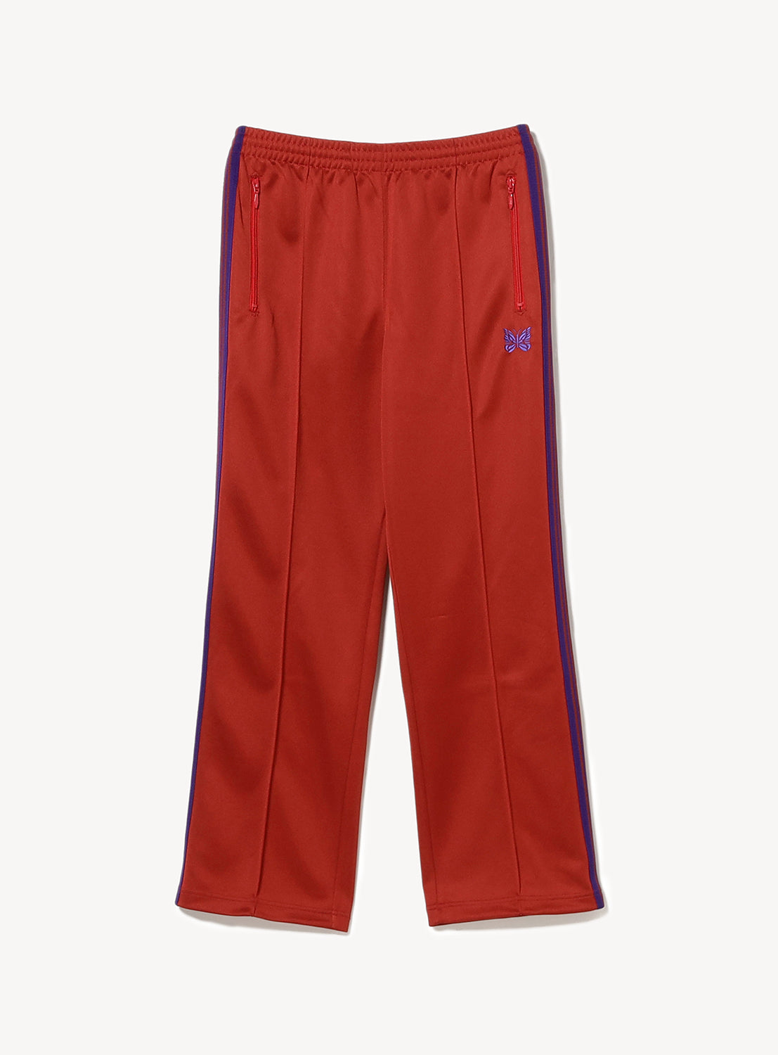 Red track pants with blue/purple stripes on the side, two zipper pockets and a purple embroidered butterfly. 