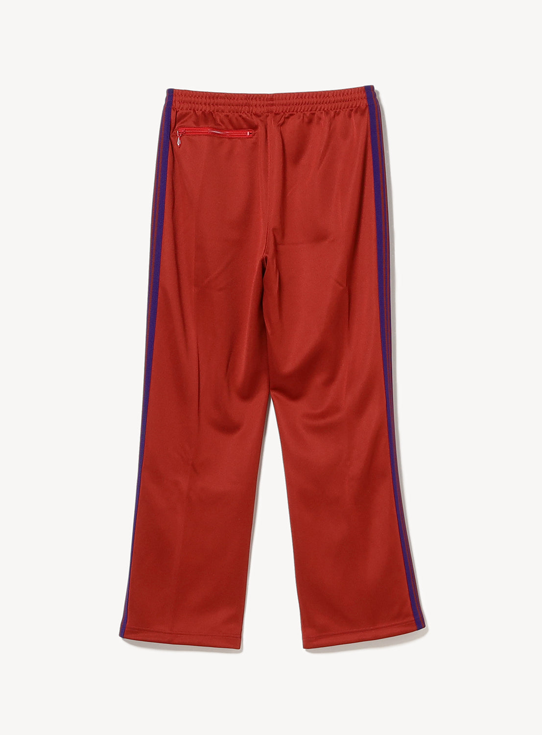 Red track pants with blue/purple stripes on the side and a back zipper pocket.