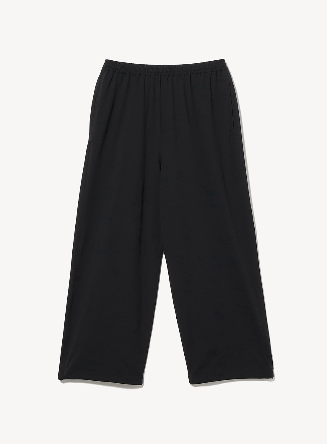 The BEAMS Wide Straight Fit Dynamic Dry Easy Pants are loose-fitting black pants with a wide silhouette and an elastic waistband, shown laid flat on a white background. Crafted from quick-drying material, these minimalist pants feature wide legs and a simple design.