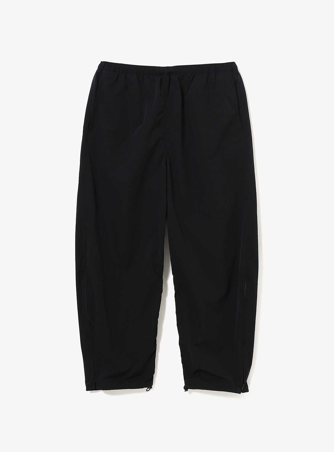 Black Technical 2-Way Adjustable Easy Pants in stretch double-weave fabric with an elastic waist and zippers at the bottom of each leg.