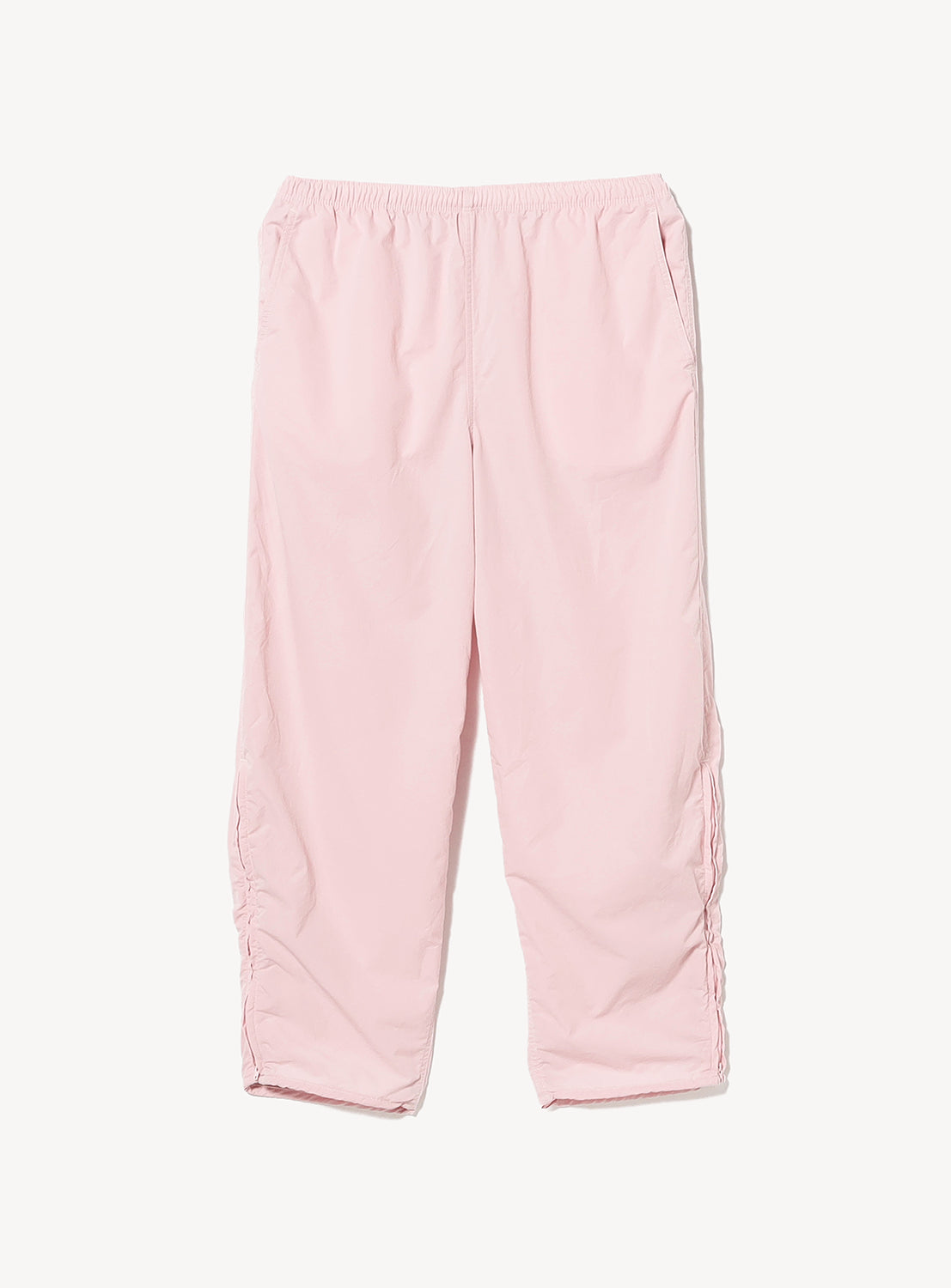 Light pink BEAMS Technical 2-Way Adjustable Easy Pants featuring a wide, straight-leg fit, an elastic waist, and adjustable cinch cords along each leg.