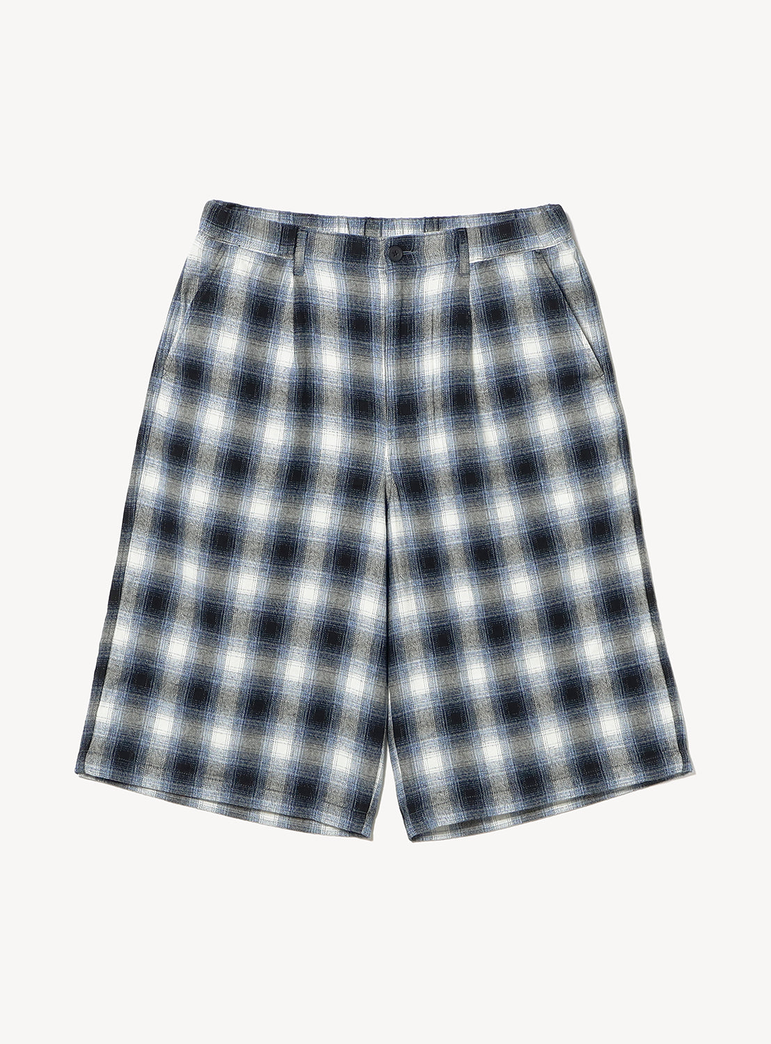 BEAMS Check Shorts in a mid-length, relaxed fit with a black, gray, and white ombre check pattern and a button fly.