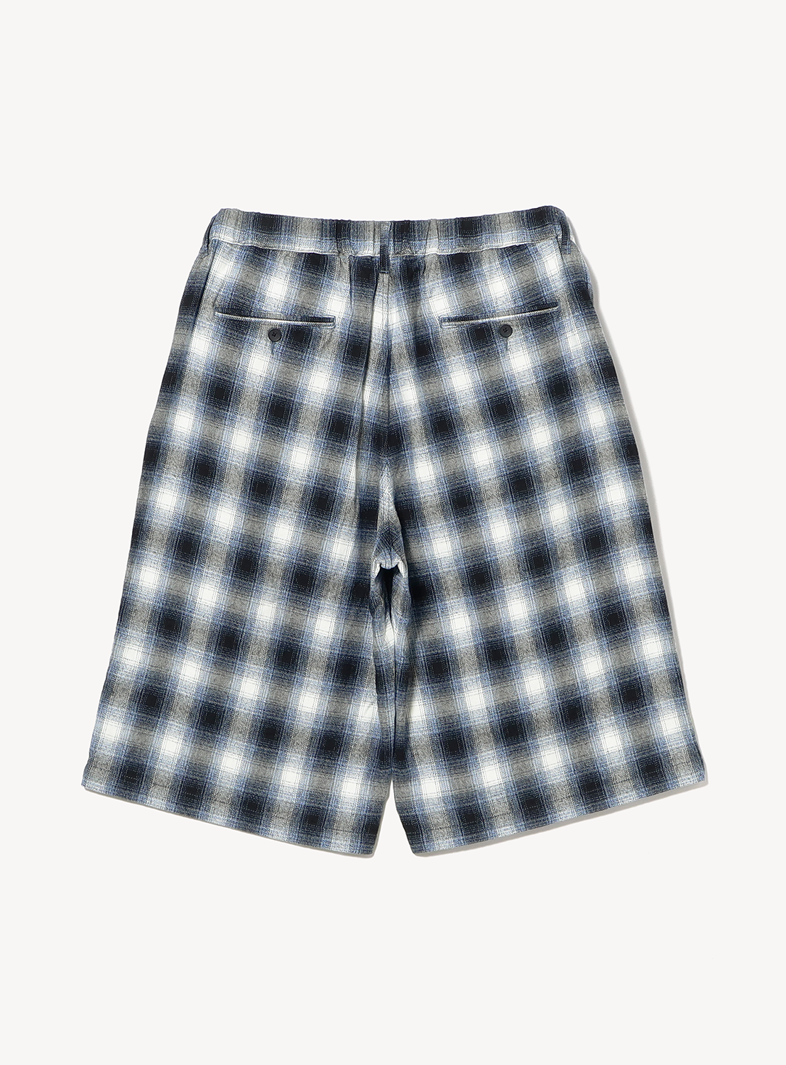 Back view of BEAMS Check Shorts, featuring a relaxed fit, knee-length design in a black, grey, and white ombre check plaid pattern with two back pockets.
