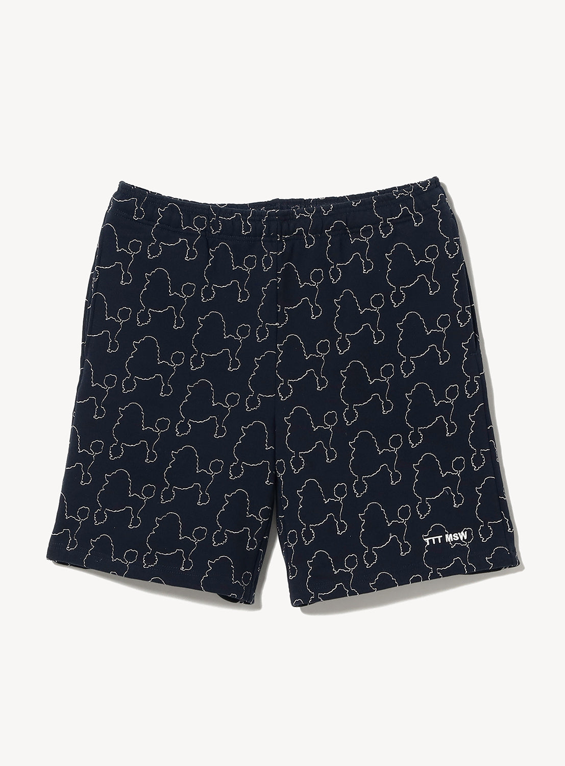 TTT MSW Dog Embroidery Half Pants in navy blue, made from soft fleece-lined fabric with an elastic waistband. These shorts feature an all-over white outline poodle pattern and a small embroidered white logo near the bottom hem.