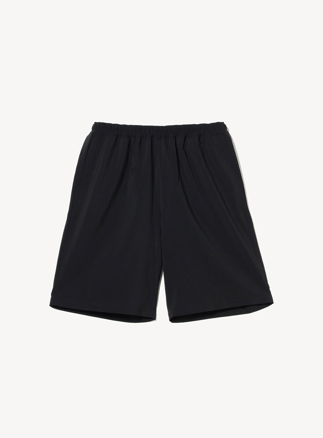 Black elastic-waist shorts flat lay, showcasing a relaxed fit and versatile style.