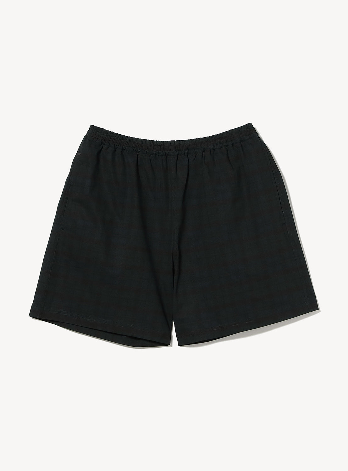 A pair of BEAMS Wide Fit Dynamic Dry Shorts in a dark plaid pattern with an elastic waistband, lightweight and performance-oriented, laid flat on a white background.