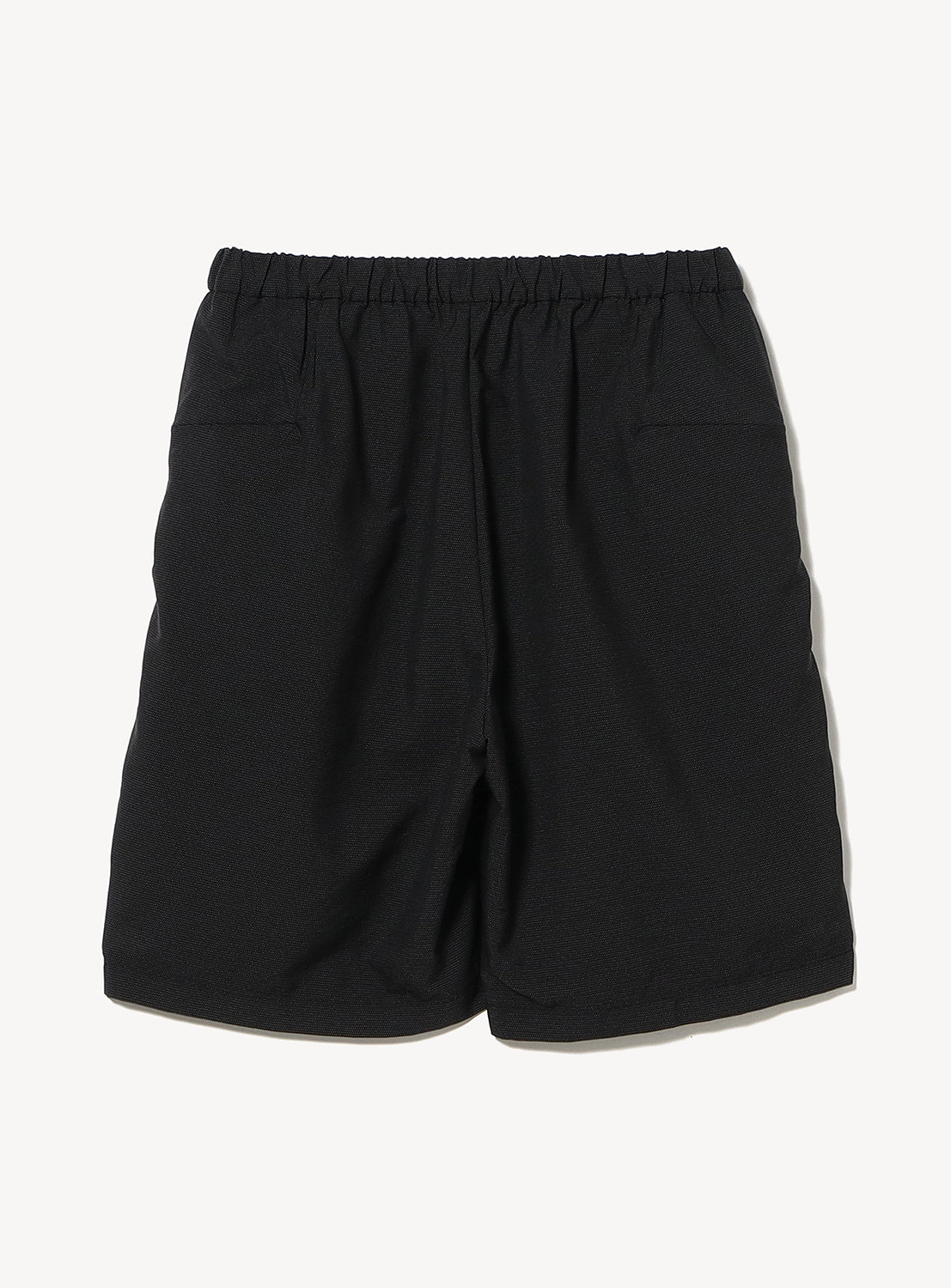 A pair of TEATORA Wallet Shorts Resort in plain black, crafted from innovative GEOGRAM textile with an elastic waistband, two back pockets, and a discreet Security Cargo Pocket, displayed on a white background.