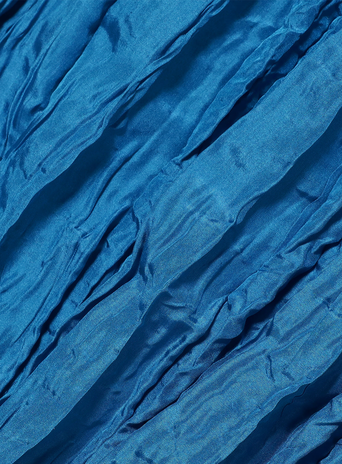 Close-up of the blue, textured fabric with a subtle crinkle pattern.