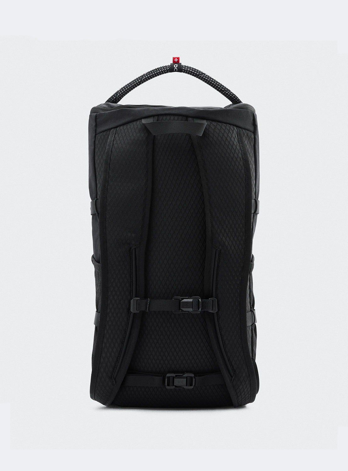 Back of a black camping backpack with adjustable straps and a sleek silhouette. 