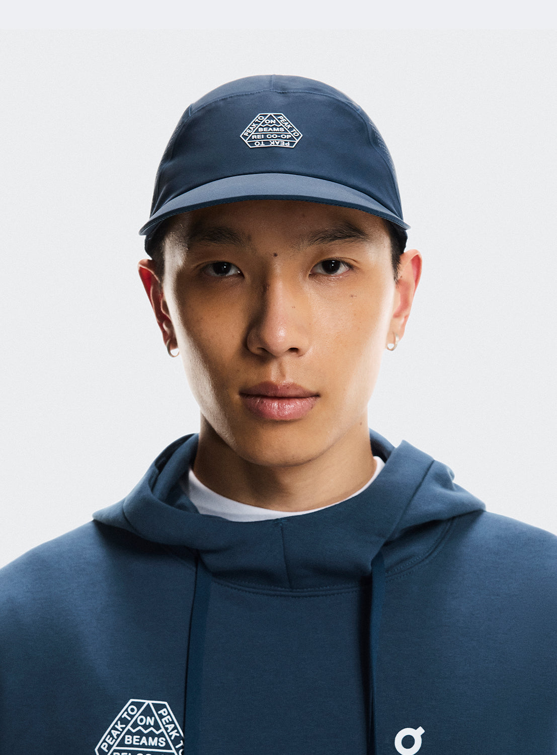 Navy cap with BEAMS X ON RUNNING X REI CO-OP logo.