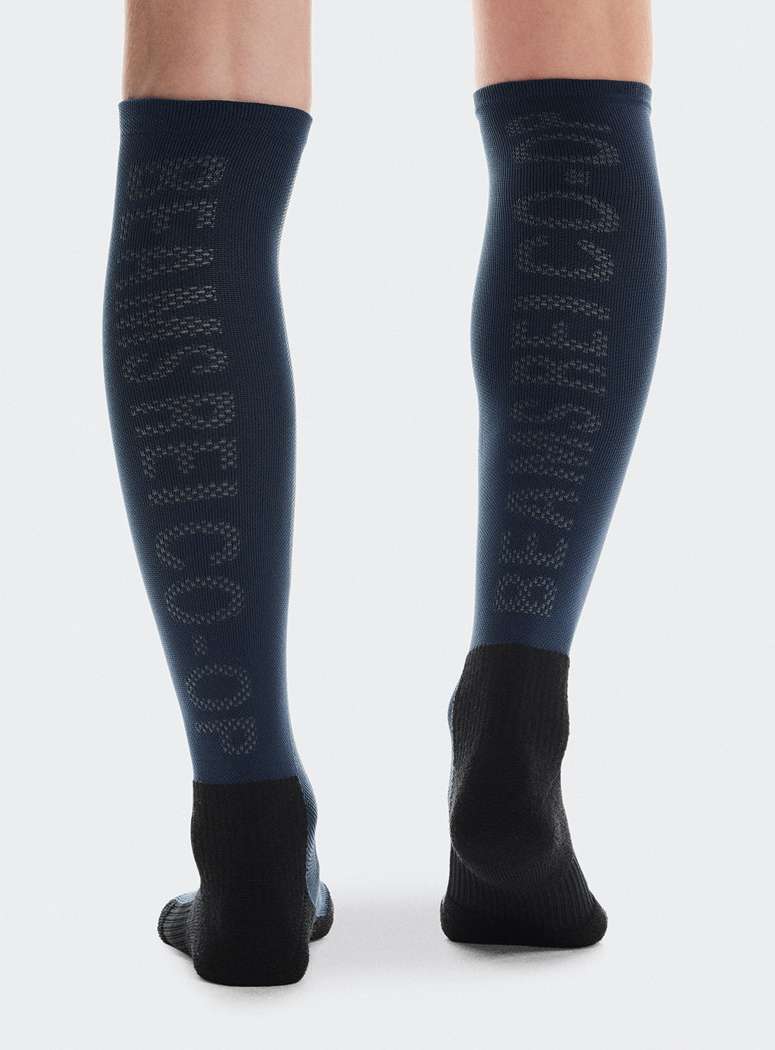 Navy blue knee-high socks with black sole and 'BEAMS REI CO-OP' on the back. 
