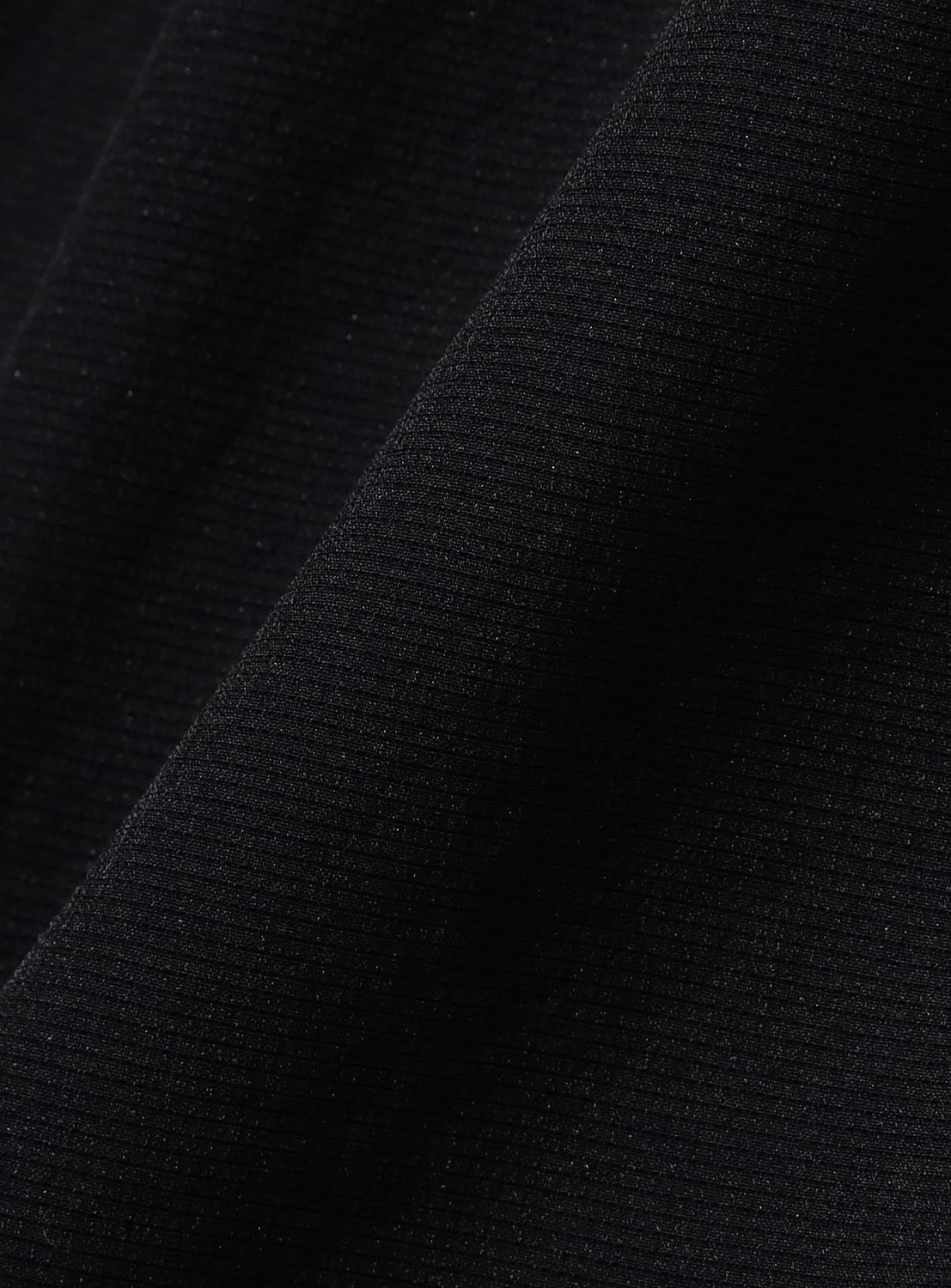 Navy material, highlighting the fabric's quality and soft drape.
