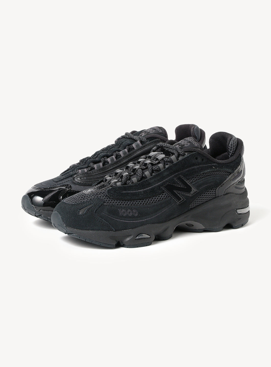New Balance x BEAMS - A revival of early-2000s performance design, the New Balance 1000 “Triple Black” merges retro-futuristic aesthetics with a bold monochromatic execution.