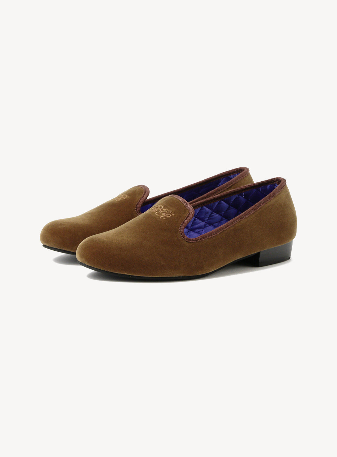 Pair of brown velvet shoes with quilted purple insole. 