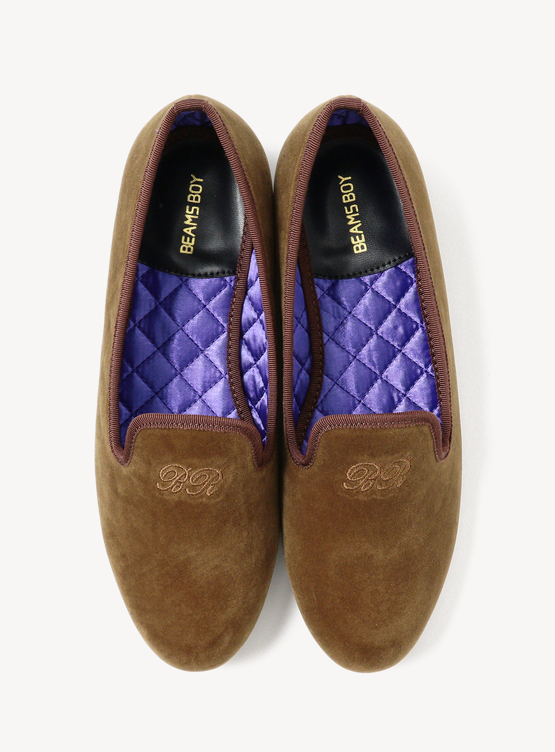 Pair of brown loafers with purple quilted lining.
