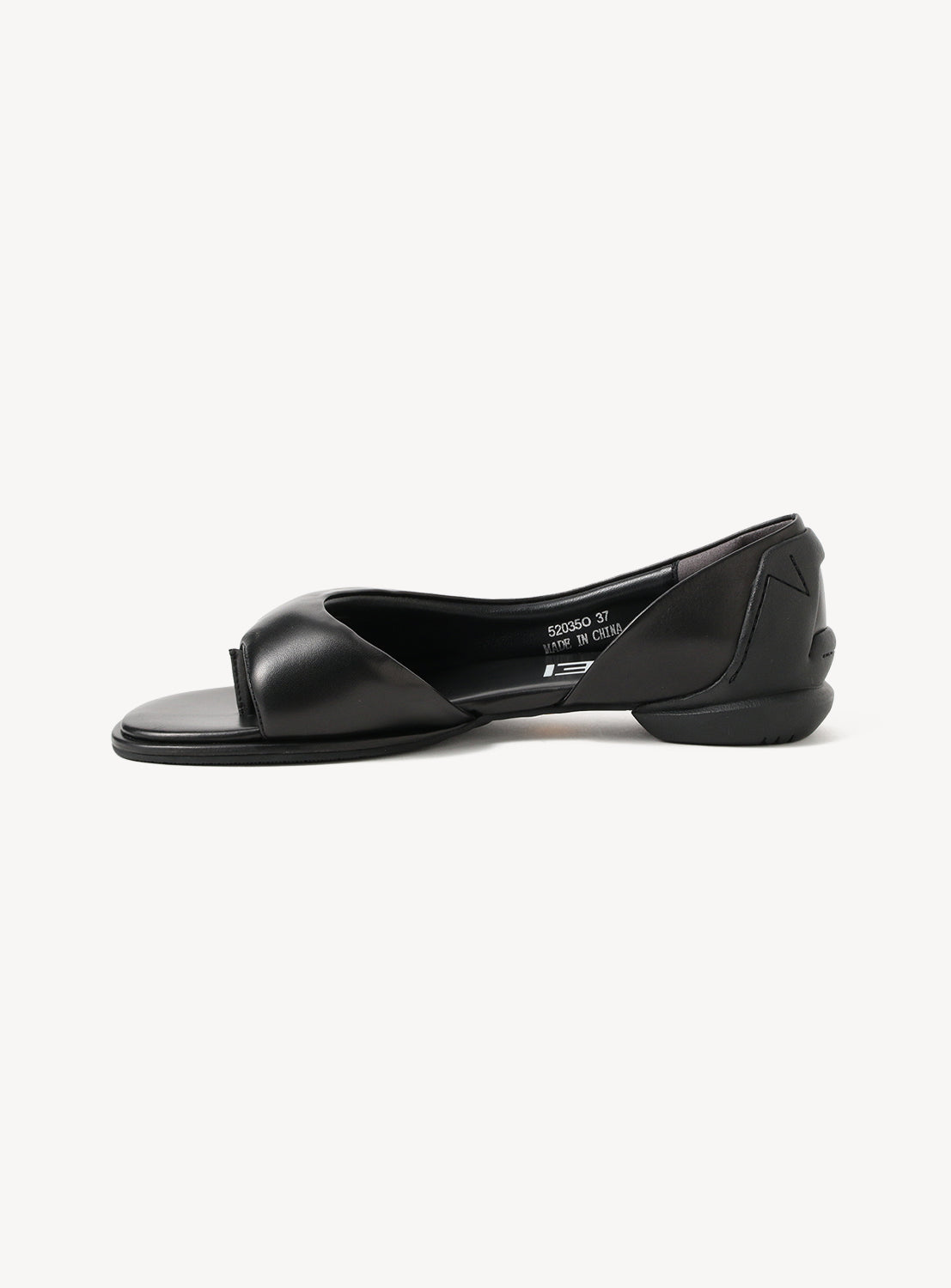 The SHISEI Nubuck Leather Padded Thong Sandals, featuring a black nubuck leather finish, curved side cutout, padded upper, low heel, and open-toe design, are shown against a plain white background.