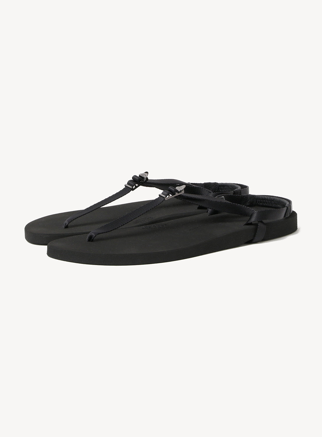 A pair of BEAUTIFUL SHOES Minimalist Huarache Barefoot Sandals in black, featuring thin straps and flat soles with a huarache-inspired design, displayed on a white background.