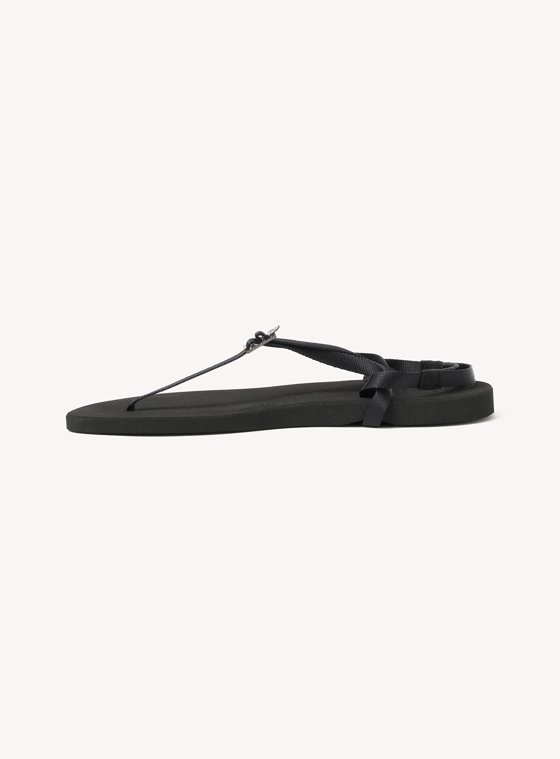 The BEAUTIFUL SHOES Minimalist Huarache Barefoot Sandals are shown in a side profile view against a white background, featuring a black, flat-soled design with thin straps and subtle Huarache-inspired details—perfect for those who appreciate minimalist barefoot sandals.